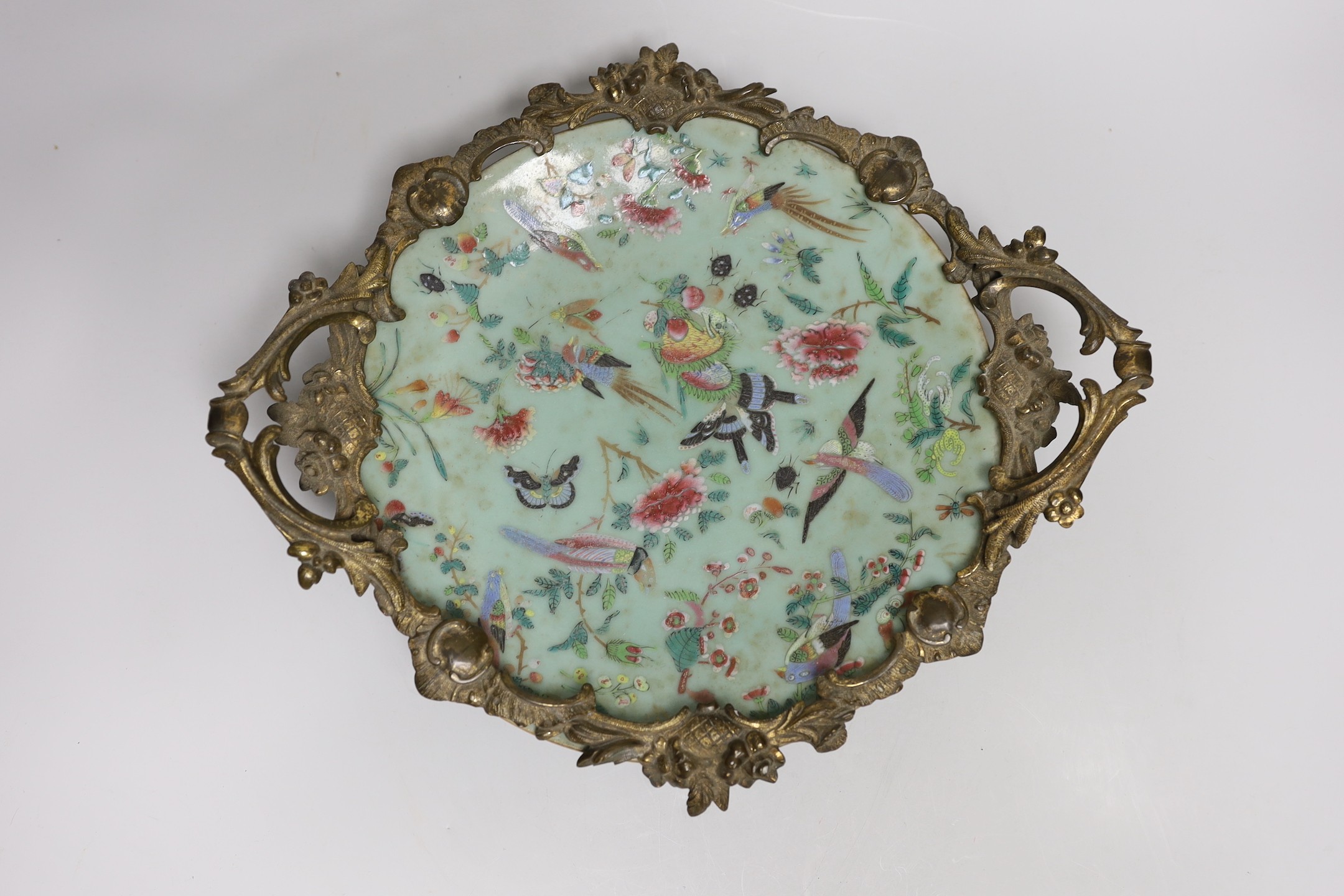 An ormolu-mounted Chinese celadon ground famille rose serving dish. 25cm wide